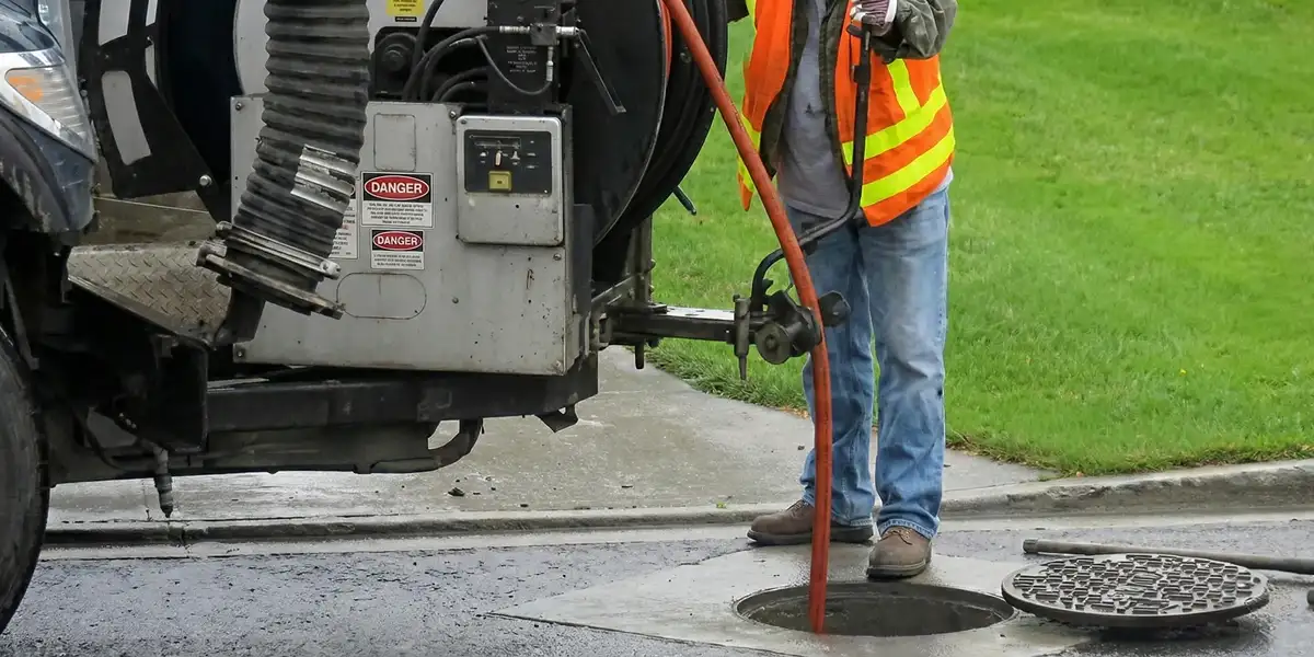 sewage clean up professionals using industrial equipment to remove contaminated wastewater in Baltimore, MD